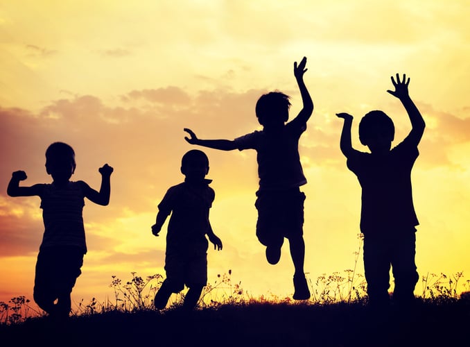 4 children running in sunset